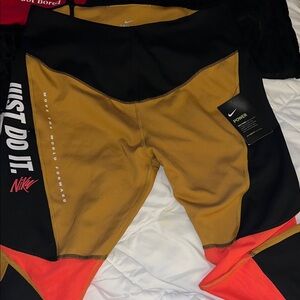 Nike Black and Gold Leggings with Orange Accents
